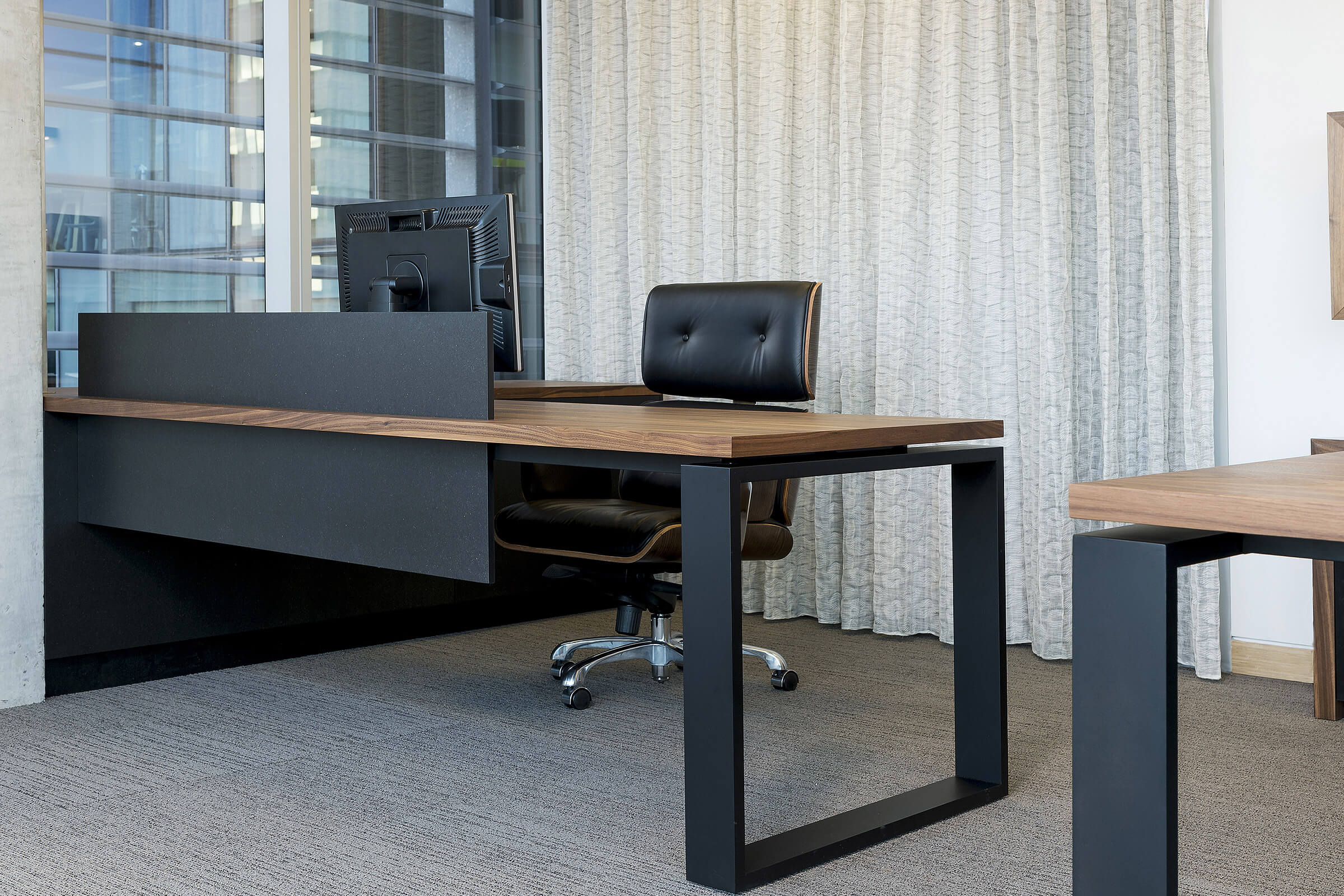 As you walk into this Adelaide city office the bespoke desk by Australian designer FrancoCrea stands out impressively in the space ready for business