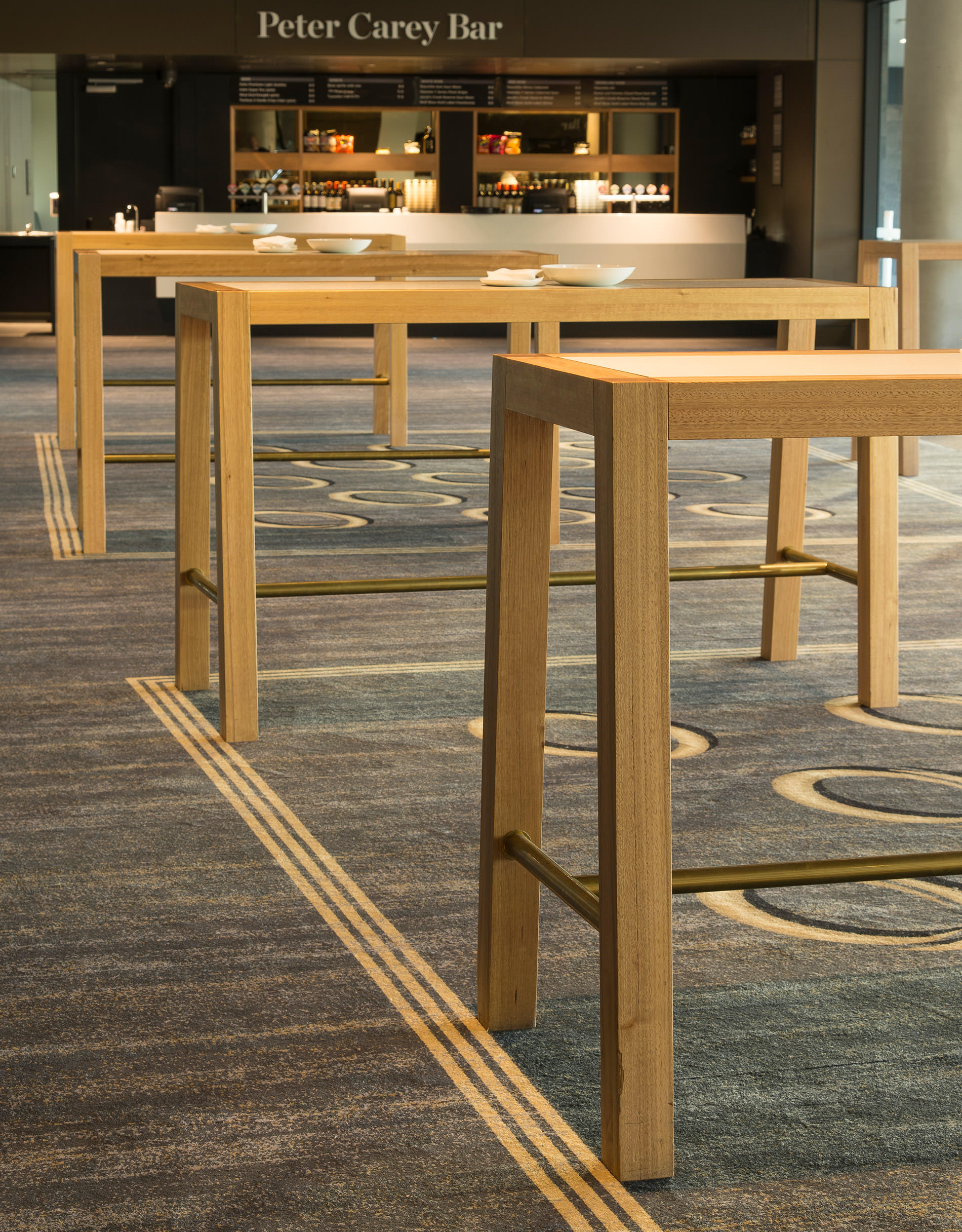 An often busy room for corporate events seems oddly calm when not in use and the solid oak designer tables by Australian designer FrancoCrea become the focal point of the room
