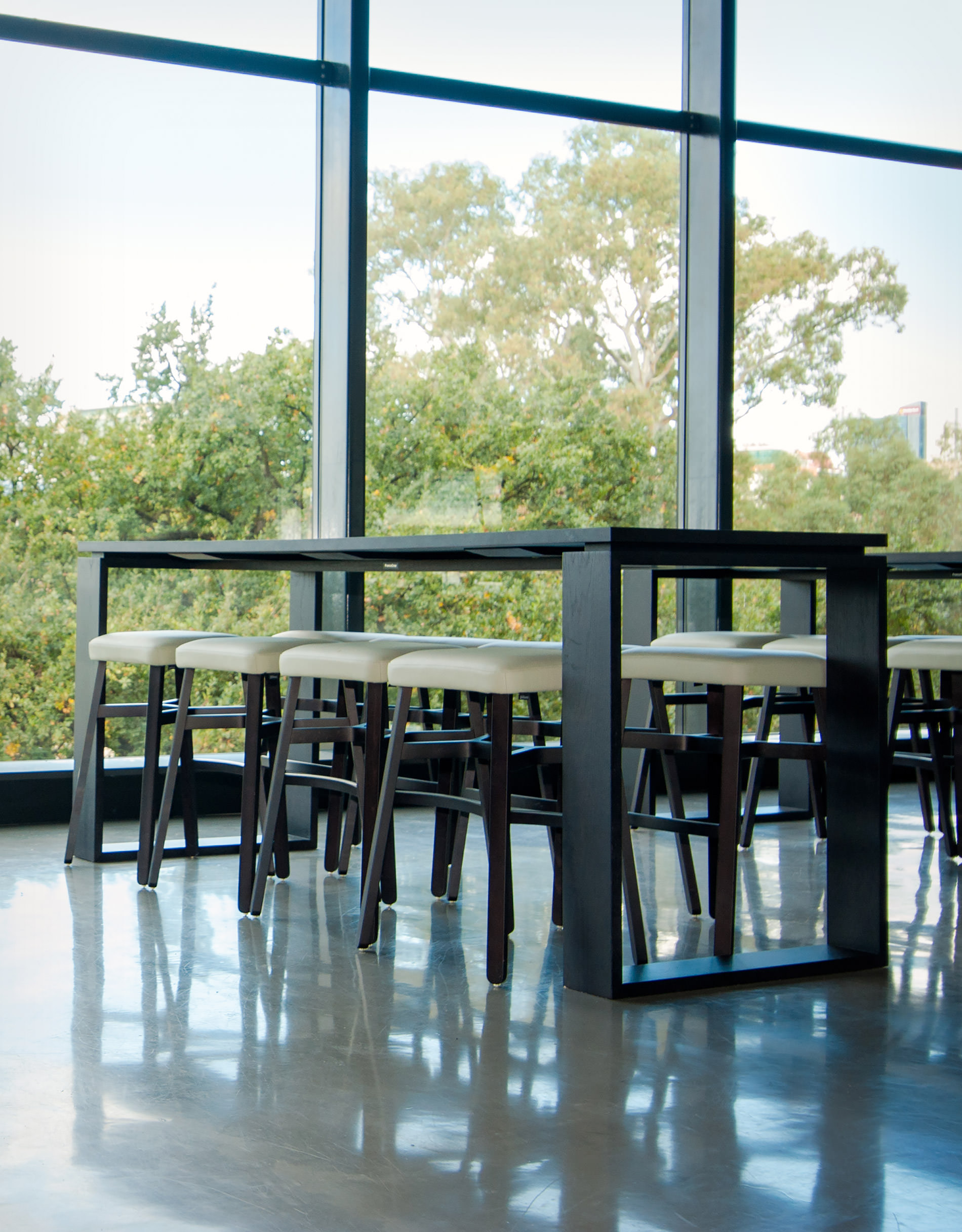 Smooth architectural lines reveal themselves as your eye glides over the black shadow line detail of this bespoke designer table by Australian designer FrancoCrea for the Adelaide oval project