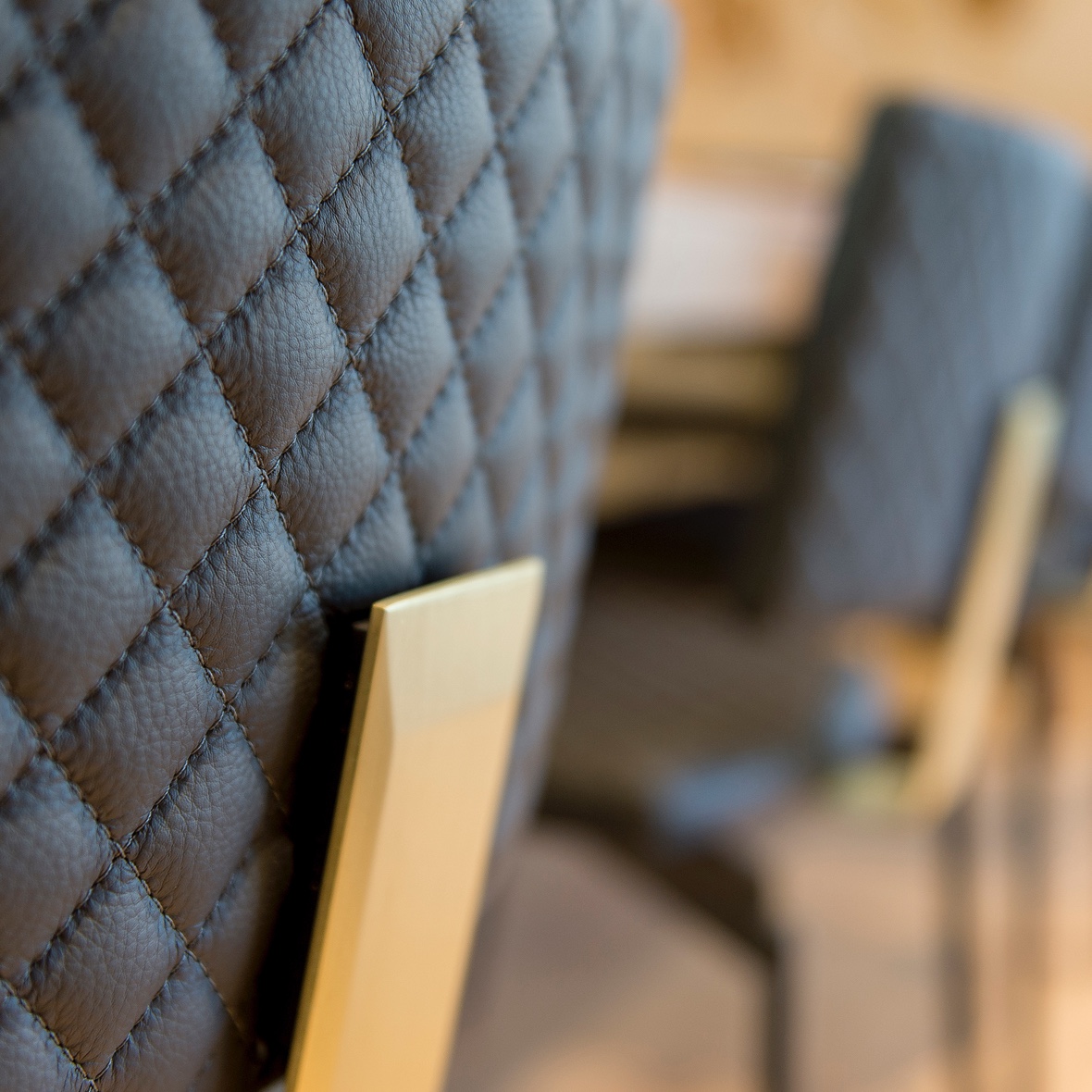 Beautiful ripples of diamond quilted premium leather cover the dining chairs created by Australian designer FrancoCrea