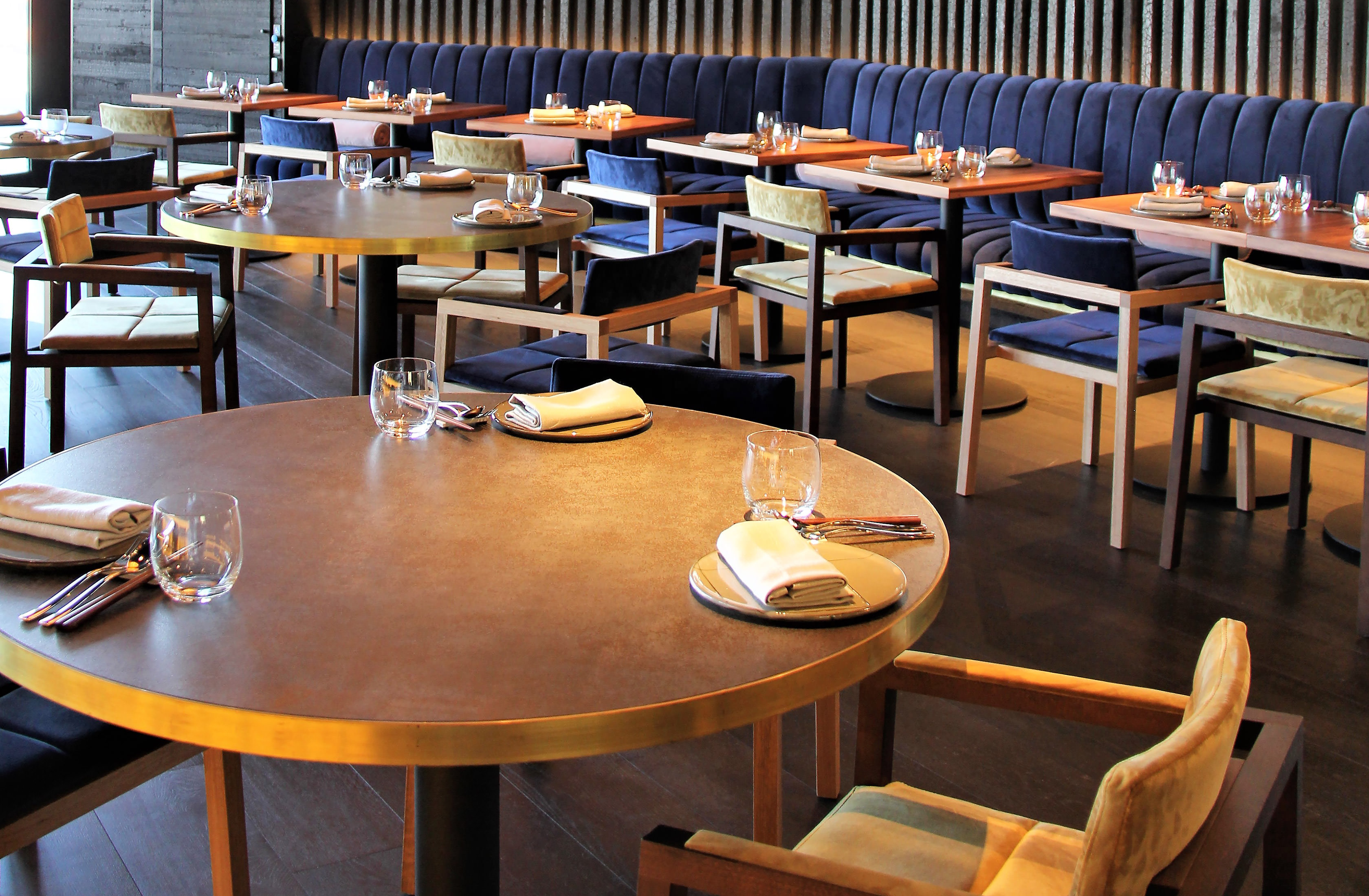 The solid walnut and velvet chairs greet you as you enter this modern Japanese restaurant for an evening of delight