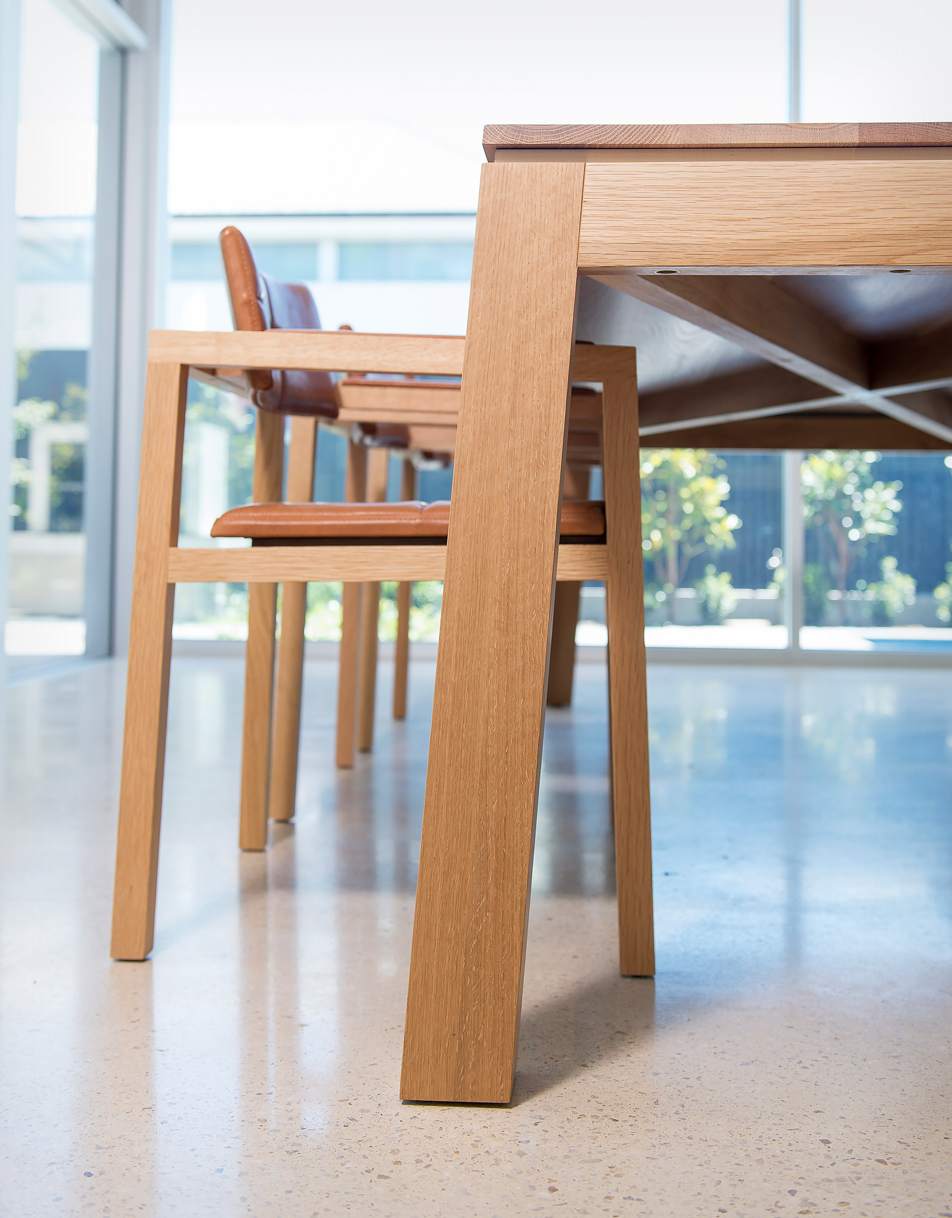 Even the underside of this designer dining table by Australian designer FrancoCrea is a refined beautiful resolution peeking through here against the concrete floors