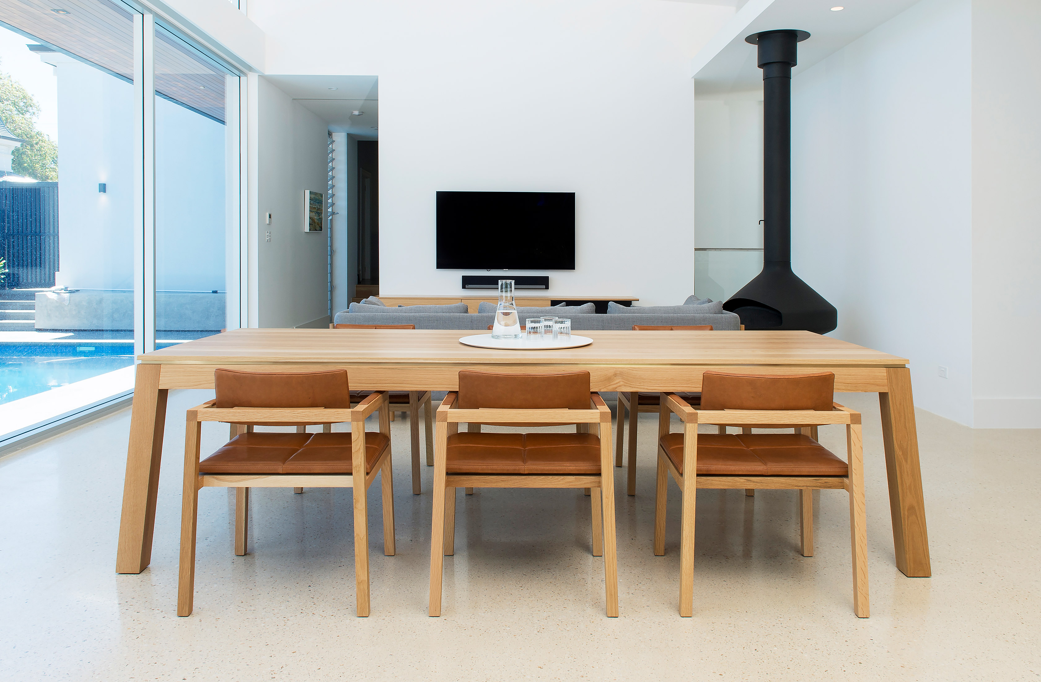 A beautifully modern home showcasing sensational minimalistic design all inclusive of this solid oak designer dining table and chairs by Australian designer FrancoCrea