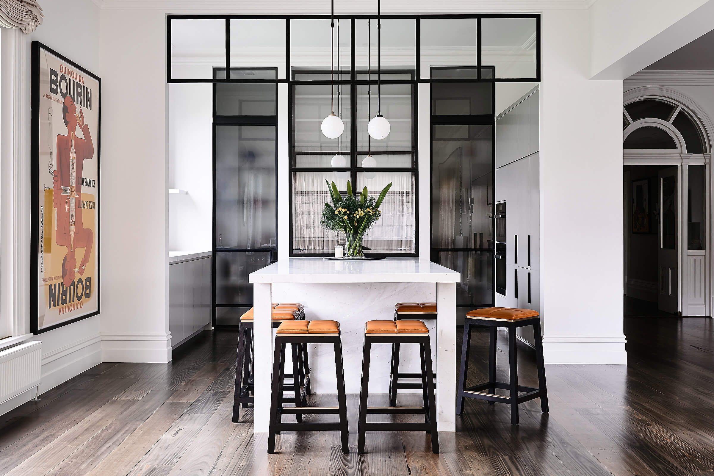 This stunning architectural home is a dream to walk through and enjoy the natural sunlight shinning through as you sit on one of the designer stools by local Australian designer francocrea