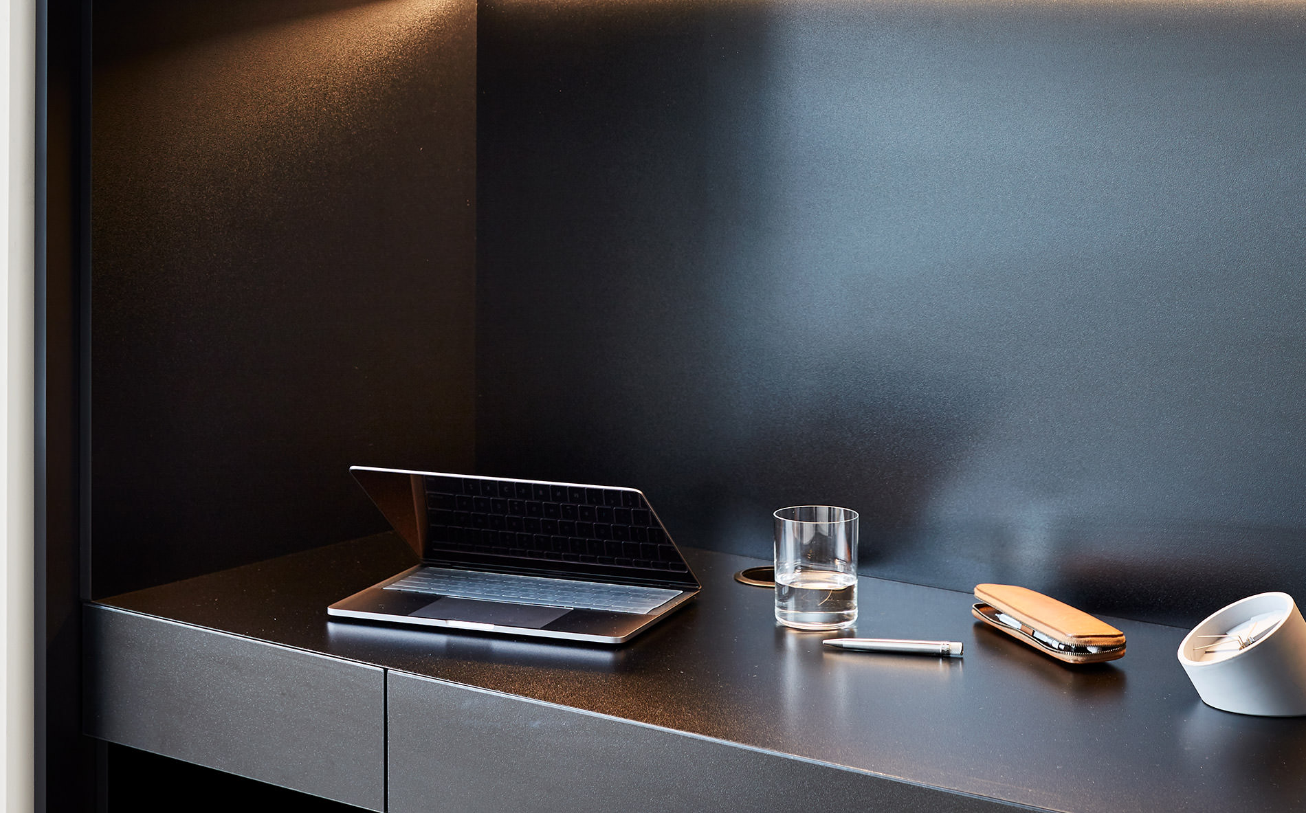 purposefully perched on a stunning back lit desk designed by Australian furniture designer FrancoCrea is a laptop read for working from home