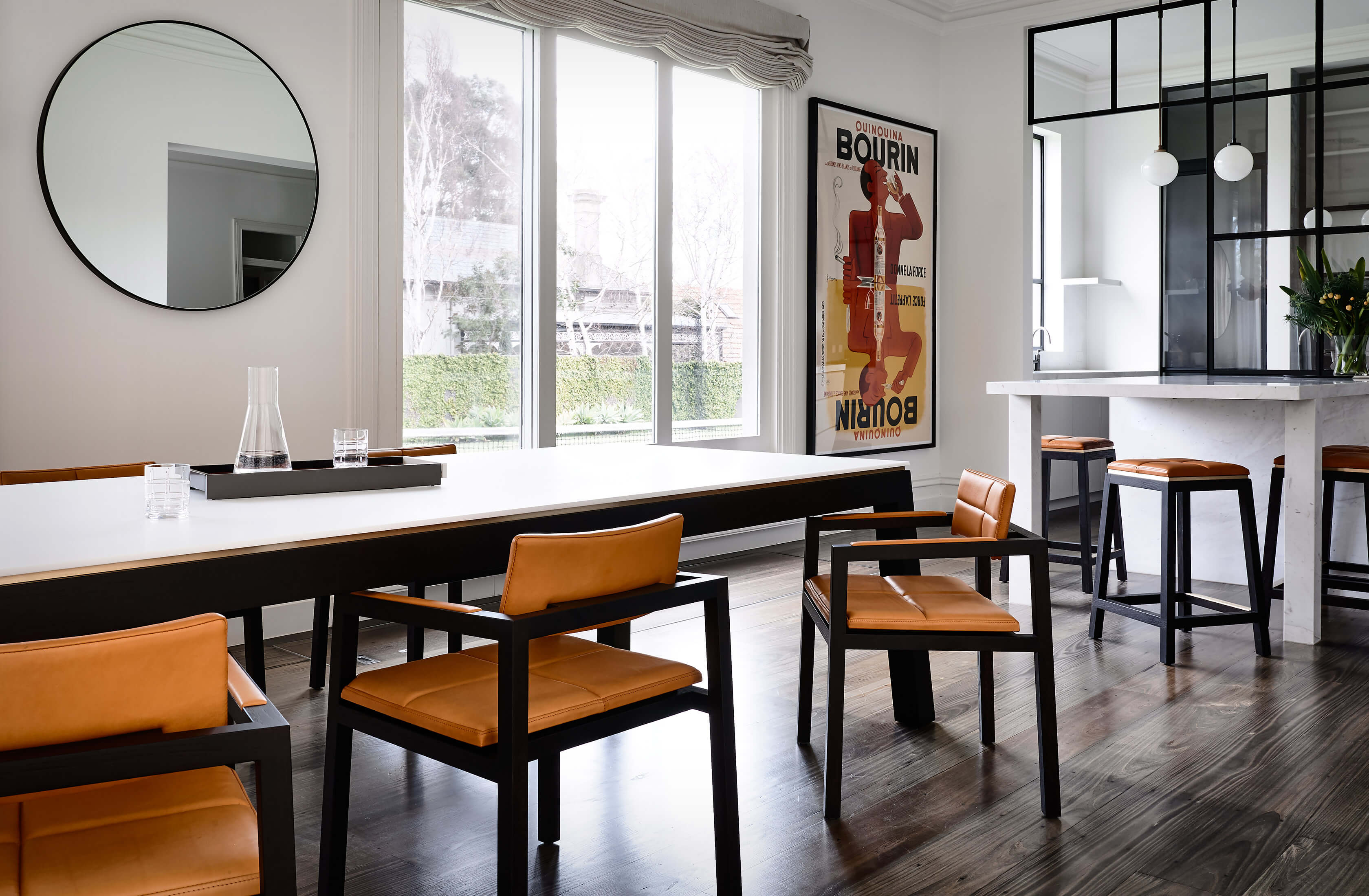 A delight to spend time in, this family dining and kitchen area invites you sit and stay a while chatting with family friends perched on the designer chairs by Australian designer francoCrea