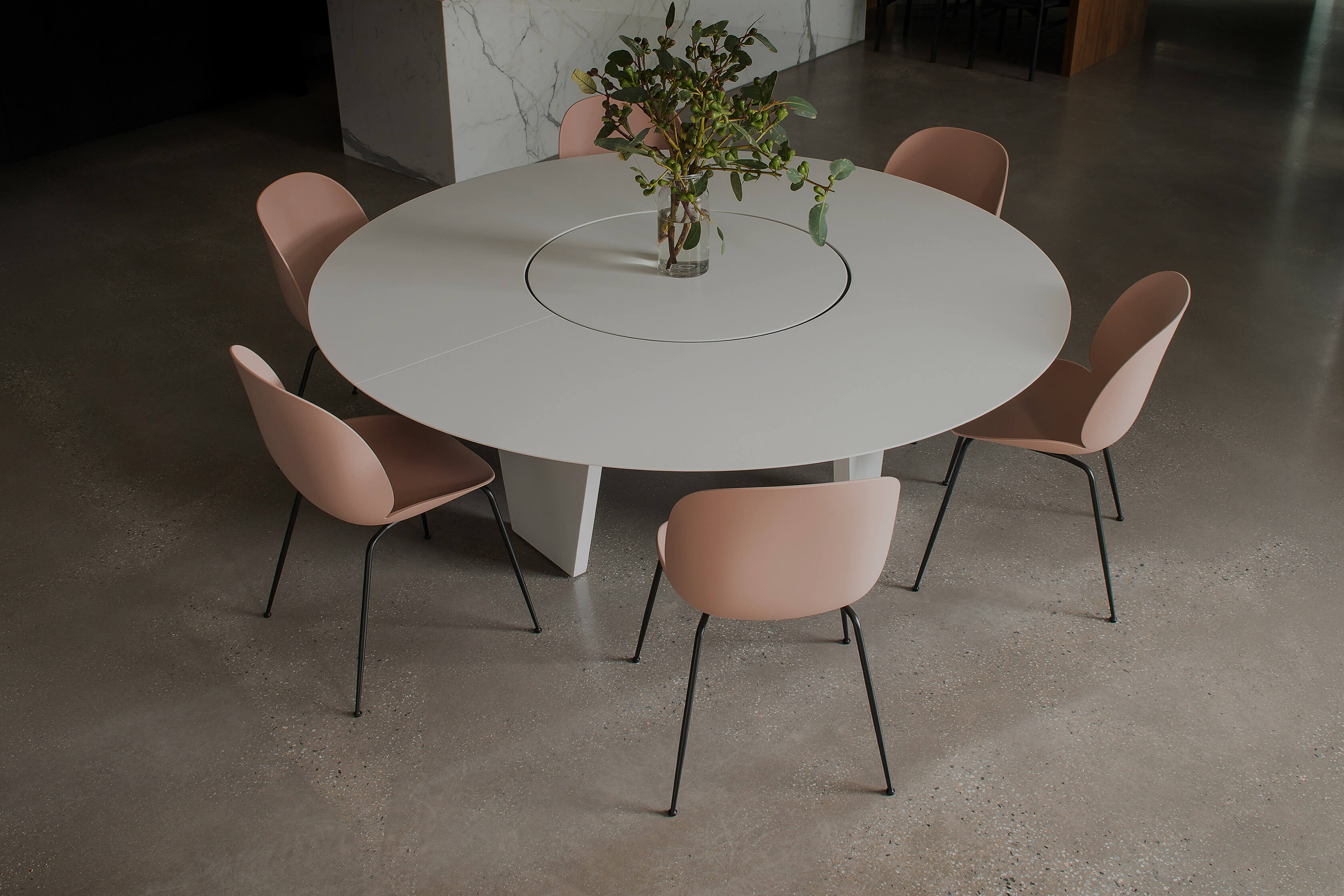 You feel a sense of inclusiveness in this architectural family home when you gather around the round designer table by Australian designer FrancoCrea
