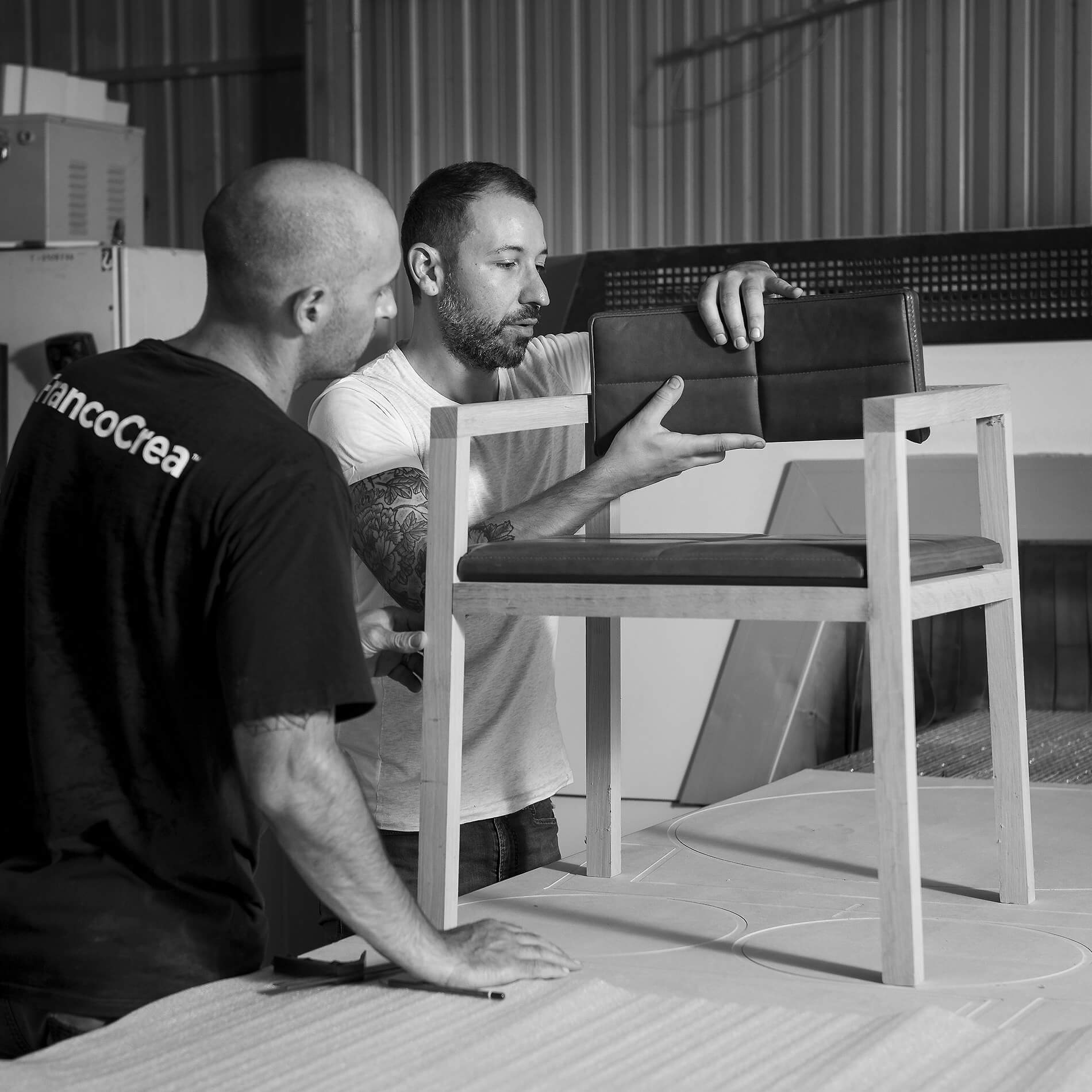 Furniture designer Franco Crea in his Adelaide workshop installing the tan leather chair back to his Mila Chair